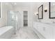 Elegant bathroom with double sinks, soaking tub, and shower at 682 E Aurora Dr, San Tan Valley, AZ 85140