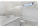 Clean bathroom with white subway tile and bathtub at 682 E Aurora Dr, San Tan Valley, AZ 85140