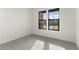 Bright bedroom with carpeted floors and large windows at 682 E Aurora Dr, San Tan Valley, AZ 85140