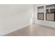 Spacious bedroom with hardwood floors and large windows at 682 E Aurora Dr, San Tan Valley, AZ 85140