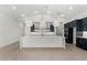 Modern kitchen with a large island and high ceilings at 682 E Aurora Dr, San Tan Valley, AZ 85140