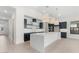 Spacious kitchen featuring a large island, modern cabinetry, and pendant lighting at 682 E Aurora Dr, San Tan Valley, AZ 85140