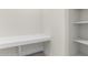 Bright laundry area with built-in shelves and a countertop at 682 E Aurora Dr, San Tan Valley, AZ 85140