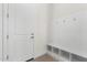 Laundry room with built-in bench and storage at 682 E Aurora Dr, San Tan Valley, AZ 85140