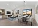 Spacious living area featuring contemporary furniture and large windows at 682 E Aurora Dr, San Tan Valley, AZ 85140