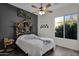 Bedroom with unique headboard and ceiling fan at 5221 E Thunder Hawk Rd, Cave Creek, AZ 85331