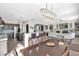 Open concept dining room with a large table and views into the Gathering room and kitchen at 5221 E Thunder Hawk Rd, Cave Creek, AZ 85331