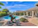 Landscaped backyard with a unique metal pig sculpture at 5221 E Thunder Hawk Rd, Cave Creek, AZ 85331