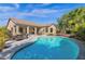 Stunning kidney-shaped pool and patio with seating area at 5221 E Thunder Hawk Rd, Cave Creek, AZ 85331