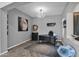 Home office with hardwood floors and large moon artwork at 5221 E Thunder Hawk Rd, Cave Creek, AZ 85331