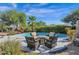 Pool area with fire pit and comfortable seating at 5221 E Thunder Hawk Rd, Cave Creek, AZ 85331