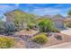 Single-story home with two-car garage and drought-tolerant landscaping at 5221 E Thunder Hawk Rd, Cave Creek, AZ 85331