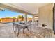 Outdoor patio with table and chairs, pool and hot tub views at 29247 N 70Th Ave, Peoria, AZ 85383