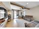 Gathering room with sliding door to backyard and rustic wood beams at 21527 N 78Th Ln, Peoria, AZ 85382