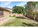 Side yard with grassy area and a storage shed at 21527 N 78Th Ln, Peoria, AZ 85382