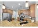 Open kitchen with stainless steel appliances and granite countertops at 21527 N 78Th Ln, Peoria, AZ 85382