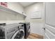 Convenient laundry room featuring a washer and dryer at 21527 N 78Th Ln, Peoria, AZ 85382