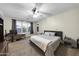 Large main bedroom with a king bed and built-in workspace at 21527 N 78Th Ln, Peoria, AZ 85382