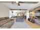 Open living room showcasing a wood feature wall and recessed lighting at 21527 N 78Th Ln, Peoria, AZ 85382