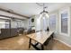 Spacious dining area with a large wooden table and window seating at 21527 N 78Th Ln, Peoria, AZ 85382