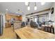 Open kitchen with wood cabinets, granite counters and island at 21527 N 78Th Ln, Peoria, AZ 85382