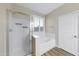 Bathroom with a shower and tub, and a window with shutters at 21527 N 78Th Ln, Peoria, AZ 85382