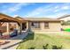 Spacious backyard with grassy area and a covered patio at 21527 N 78Th Ln, Peoria, AZ 85382