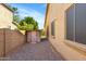 Side yard with gravel pathway and storage shed at 21527 N 78Th Ln, Peoria, AZ 85382
