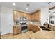 Kitchen with granite countertops, wood cabinets, and modern appliances at 21527 N 78Th Ln, Peoria, AZ 85382