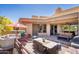 Spacious patio with seating area, dining table, and built-in grill, offering mountain views at 11166 E Prospect Point Dr, Scottsdale, AZ 85262
