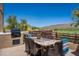 Outdoor dining area with mountain views and a built-in grill at 11166 E Prospect Point Dr, Scottsdale, AZ 85262