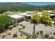Aerial view of a luxury home with mountain views and a large yard at 11166 E Prospect Point Dr, Scottsdale, AZ 85262