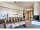 Spacious bedroom with wooden bed frame and ensuite bathroom access at 11166 E Prospect Point Dr, Scottsdale, AZ 85262