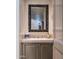 Elegant powder room with a stylish sink and decorative mirror at 11166 E Prospect Point Dr, Scottsdale, AZ 85262