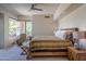 King-size bedroom with mountain views and access to a private patio at 11166 E Prospect Point Dr, Scottsdale, AZ 85262