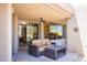 Covered patio with comfortable seating and views of the backyard at 11166 E Prospect Point Dr, Scottsdale, AZ 85262