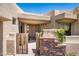 Front entry with wooden gate and stone accents at 11166 E Prospect Point Dr, Scottsdale, AZ 85262