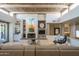 Living room with a fireplace, high ceilings, and large windows at 11166 E Prospect Point Dr, Scottsdale, AZ 85262