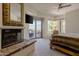 Main bedroom with fireplace, mountain views, and patio access at 11166 E Prospect Point Dr, Scottsdale, AZ 85262