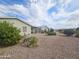 Landscaped backyard with gravel and desert plants at 650 N Hawes Rd # 4409, Mesa, AZ 85207