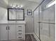 Bathroom with white vanity, walk-in shower, and gray floor at 650 N Hawes Rd # 4409, Mesa, AZ 85207