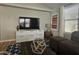 Living room with sectional sofa and entertainment center at 650 N Hawes Rd # 4409, Mesa, AZ 85207