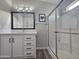 Bright bathroom with white vanity, walk-in shower, and updated fixtures at 650 N Hawes Rd # 4409, Mesa, AZ 85207