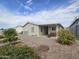 Landscaped backyard with gravel and desert plants at 650 N Hawes Rd # 4409, Mesa, AZ 85207