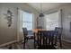 Cozy dining area with wood table and chairs, near large windows at 650 N Hawes Rd # 4409, Mesa, AZ 85207