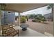 Relaxing patio area with table and bench, overlooking yard at 650 N Hawes Rd # 4409, Mesa, AZ 85207