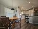 Bright kitchen with white cabinets, wood floors, and breakfast nook at 650 N Hawes Rd # 4409, Mesa, AZ 85207