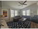 Living room with sectional sofa, coffee table, and patterned rug at 650 N Hawes Rd # 4409, Mesa, AZ 85207