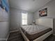 Bright bedroom with a queen-size bed and large window at 650 N Hawes Rd # 4409, Mesa, AZ 85207