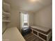 Small bedroom with desk, shelving and twin bed at 650 N Hawes Rd # 4409, Mesa, AZ 85207